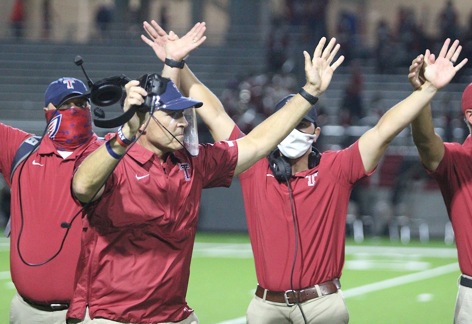 Following his team's 24-19 win over Katy on Nov. 5, Coach Todd McVey (front) and the Tompkins Falcons are now ranked No. 7 in the state and No. 25 nationally.